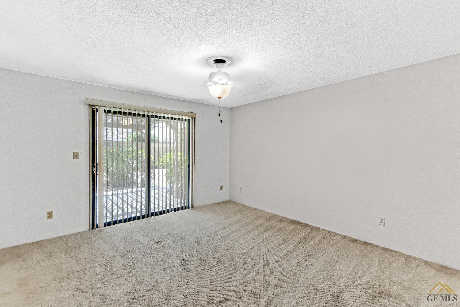 Undisclosed Address Bakersfield, CA 93311 - Photo 14 of 50 wooden floor in an empty room with a window