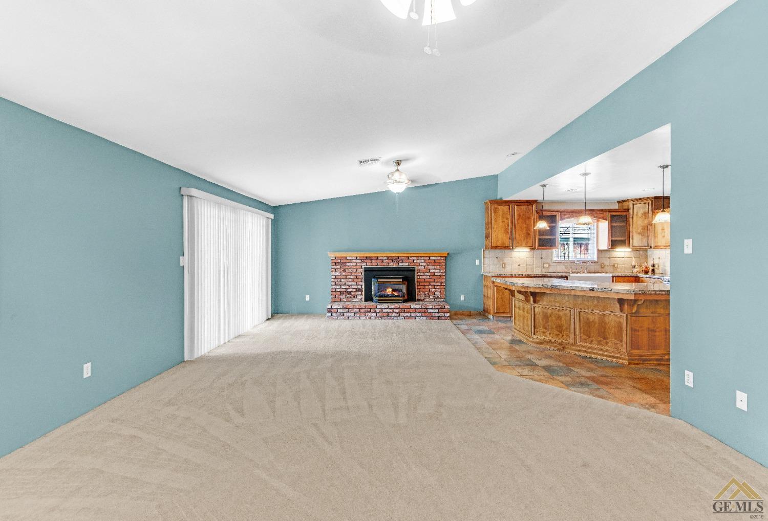 Undisclosed Address Bakersfield, CA 93311 - Photo 20 of 50 a room with a bed and a view of kitchen