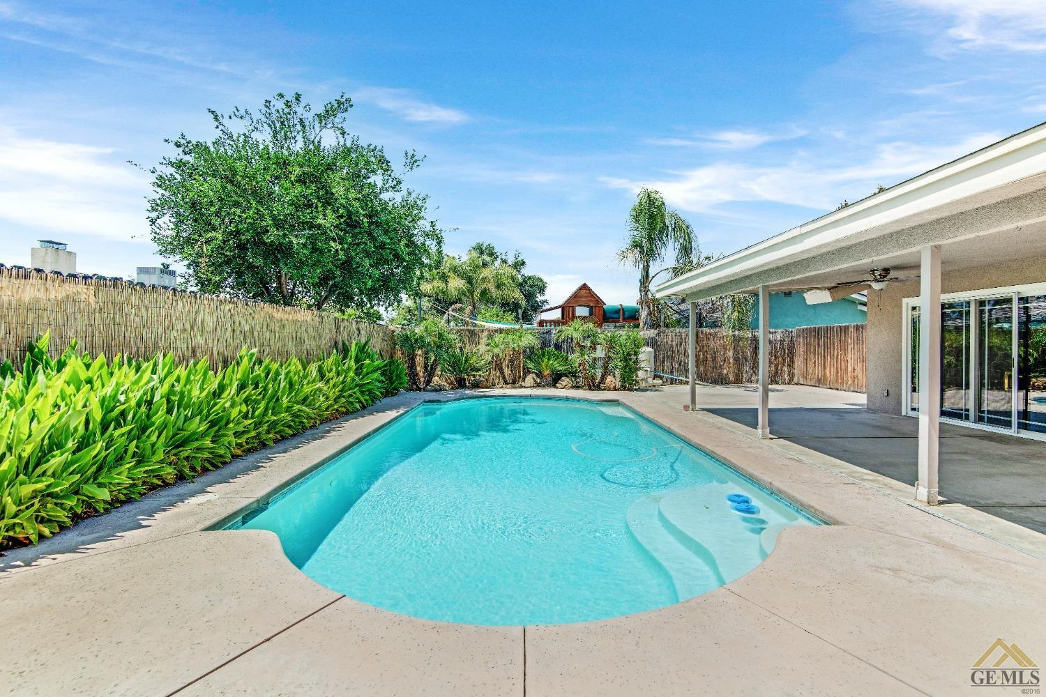 Undisclosed Address Bakersfield, CA 93311 - Photo 39 of 50 a view of a swimming pool with a patio