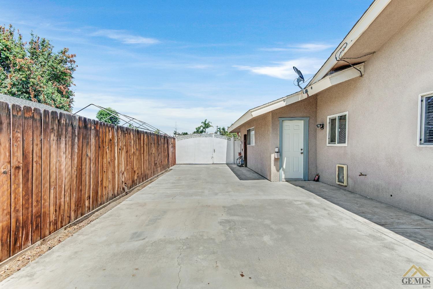 Undisclosed Address Bakersfield, CA 93311 - Photo 46 of 50 a view of a house with a backyard