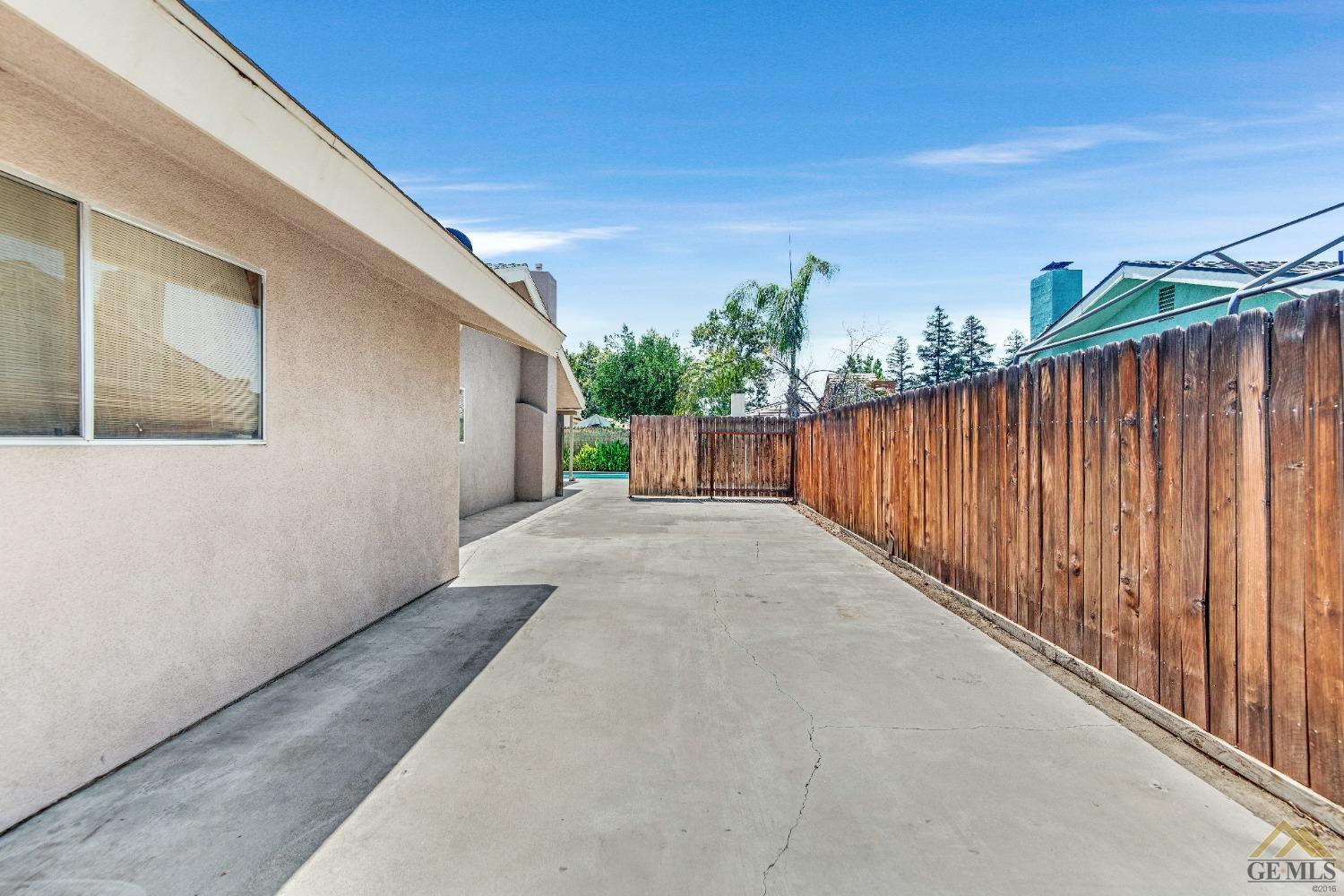 Undisclosed Address Bakersfield, CA 93311 - Photo 47 of 50 a view of a backyard with wooden fence