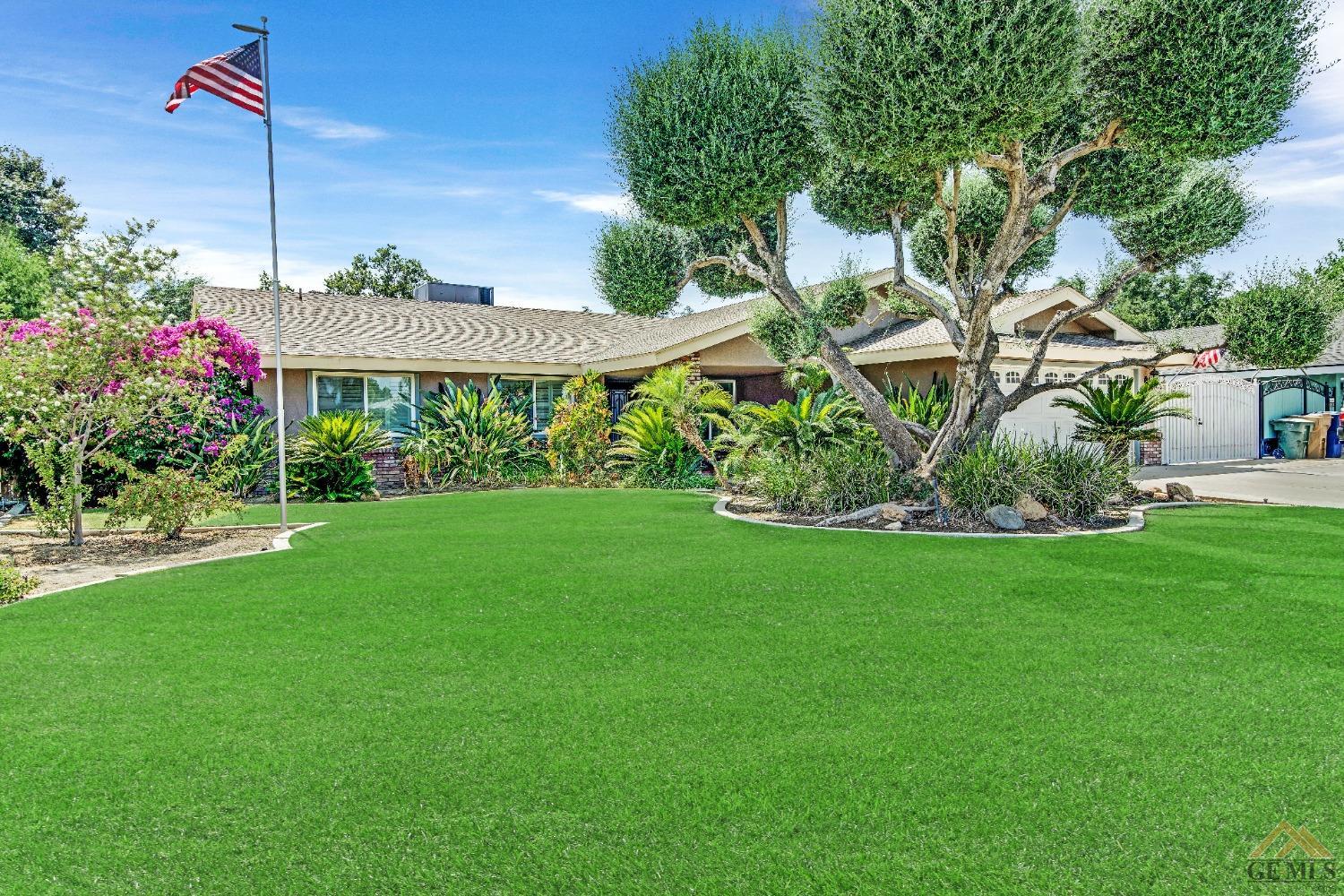 Undisclosed Address Bakersfield, CA 93311 - Photo 50 of 50 a front view of a house with a garden
