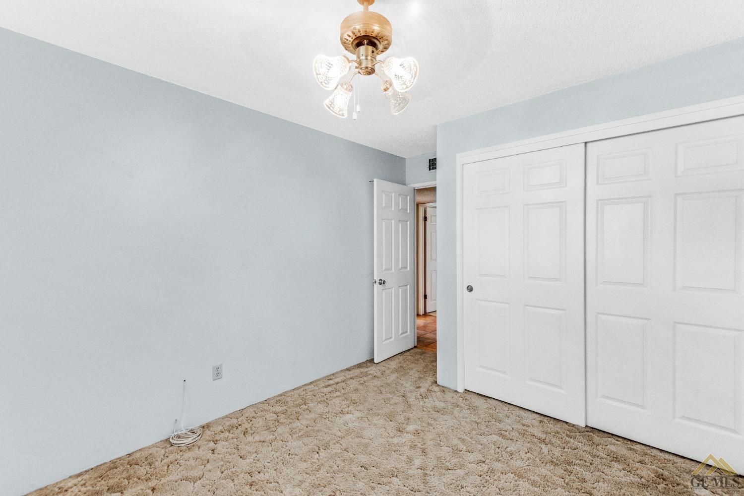 Undisclosed Address Bakersfield, CA 93311 - Photo 7 of 50 a view of a chandelier fan and entryway in a room