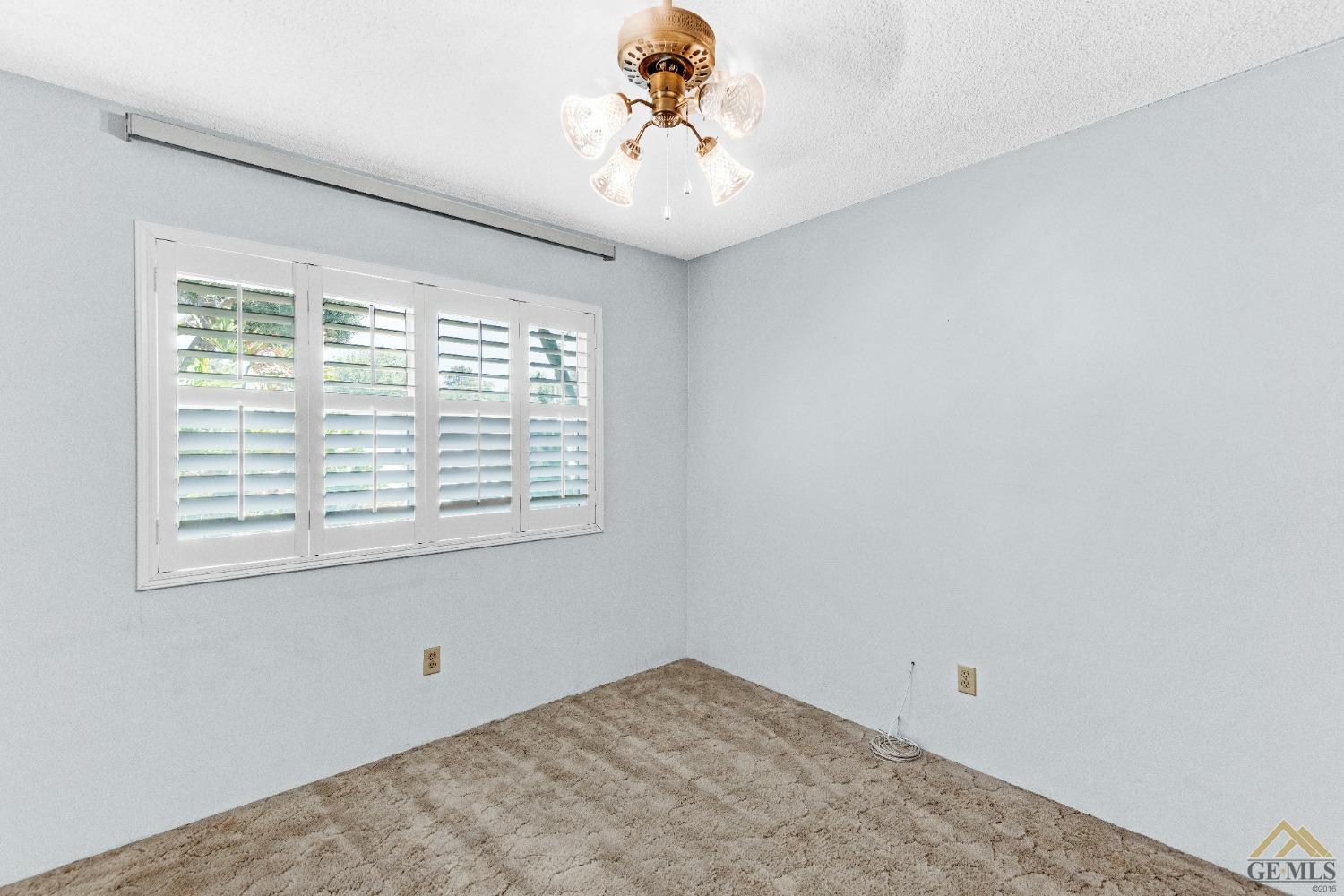 Undisclosed Address Bakersfield, CA 93311 - Photo 8 of 50 an empty room with a window