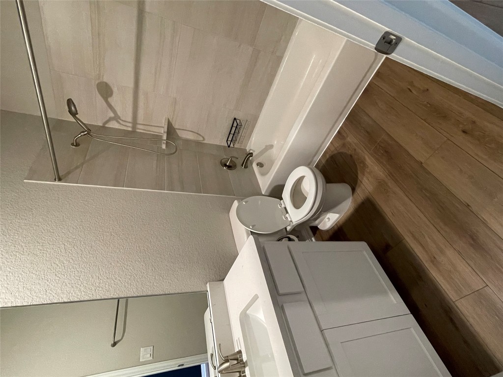 105 Sungrove Trail Georgetown, TX 78628 - Photo 12 of 18 a bathroom with a sink a toilet and shower