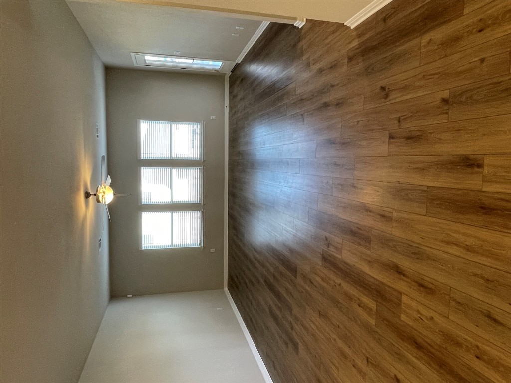105 Sungrove Trail Georgetown, TX 78628 - Photo 3 of 18 an empty room with wooden floor and windows