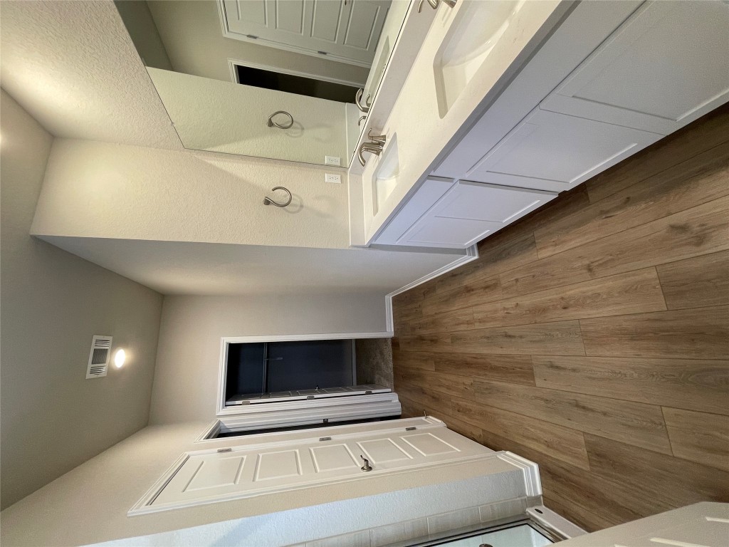 105 Sungrove Trail Georgetown, TX 78628 - Photo 6 of 18 a bathroom with a sink and mirror