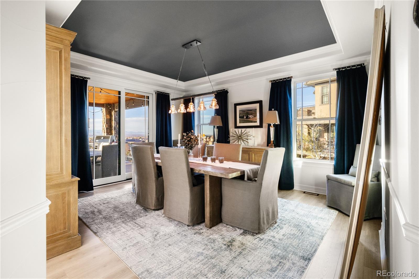 10785 Sundial Rim Road Highlands Ranch, CO 80126 - Photo 11 of 43 a view of a dining room with furniture window and outside view