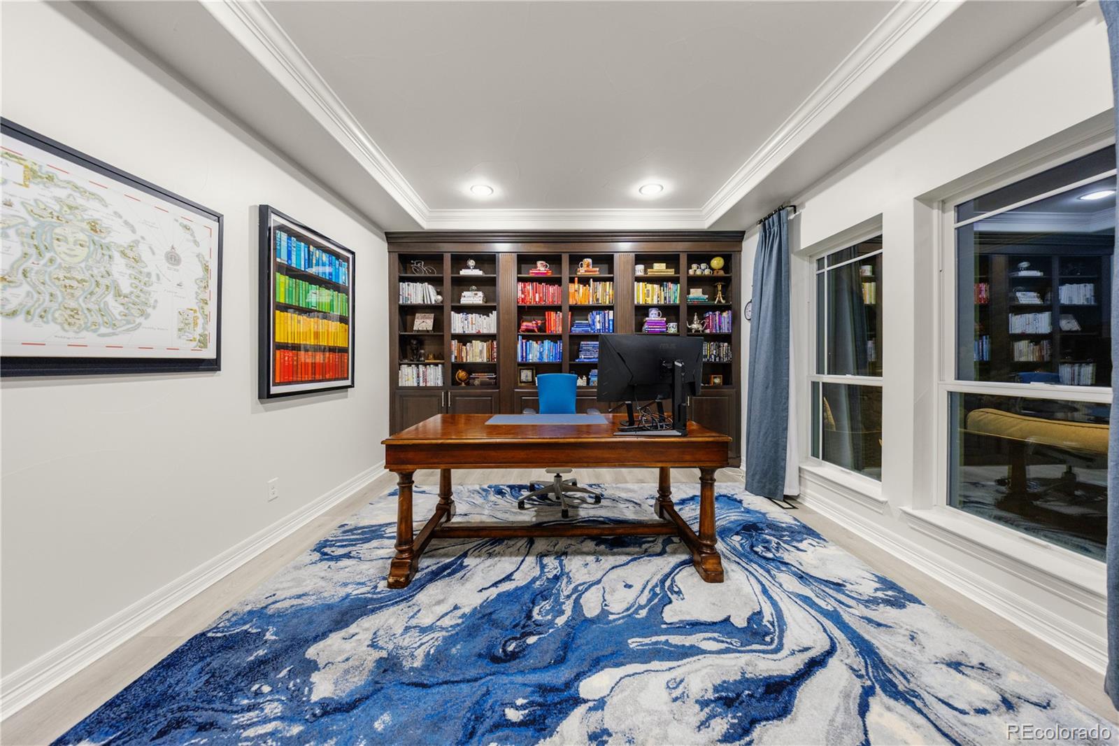 10785 Sundial Rim Road Highlands Ranch, CO 80126 - Photo 13 of 43 a view of a workspace with furniture wooden floor and a window