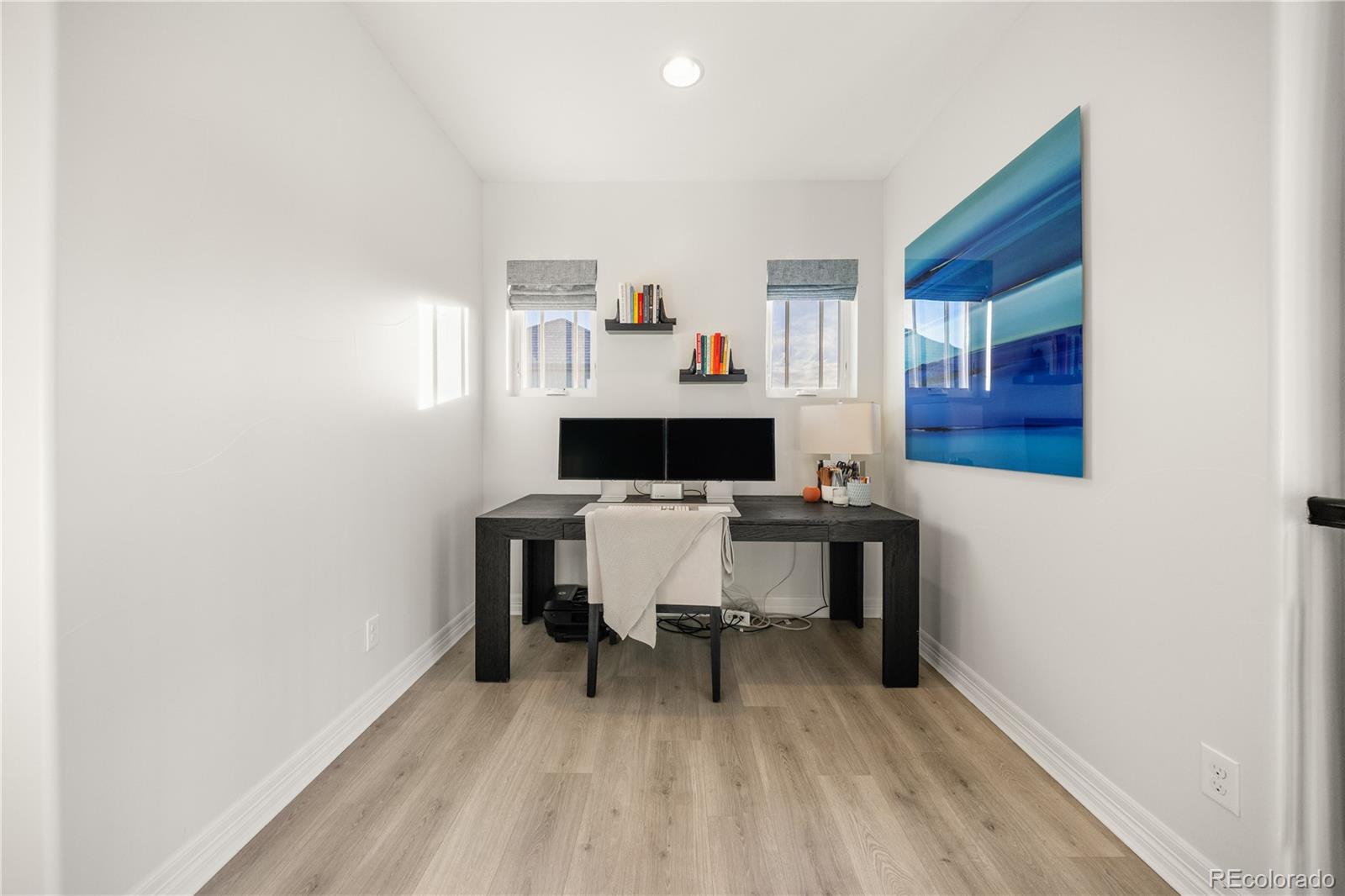 10785 Sundial Rim Road Highlands Ranch, CO 80126 - Photo 21 of 43 a living room with furniture and a wooden floor