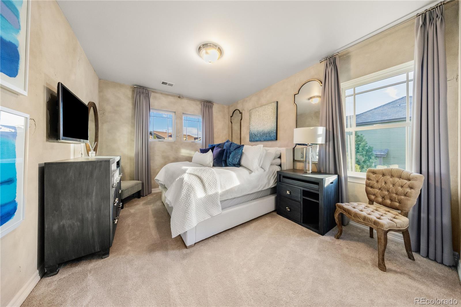 10785 Sundial Rim Road Highlands Ranch, CO 80126 - Photo 24 of 43 a bedroom with a bed and a couch