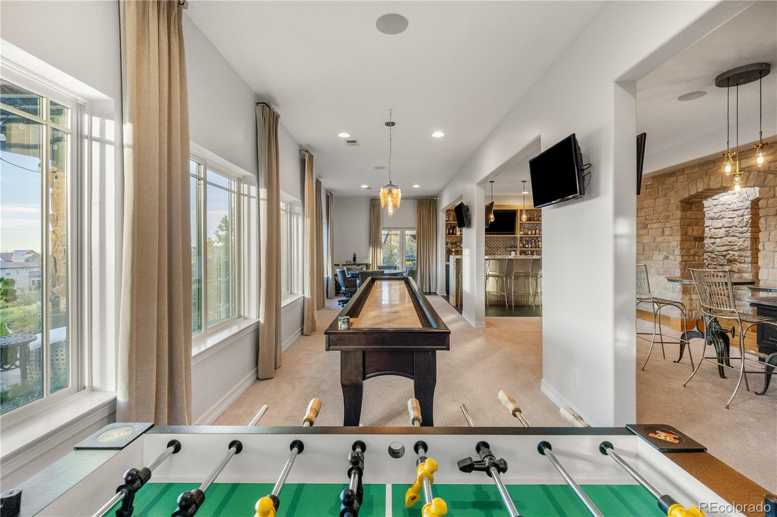 10785 Sundial Rim Road Highlands Ranch, CO 80126 - Photo 26 of 43 a room with pool table and windows