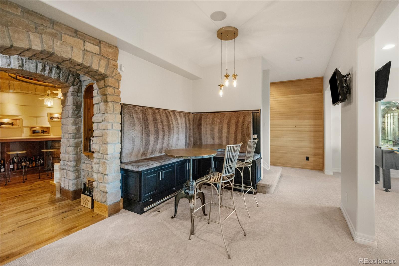 10785 Sundial Rim Road Highlands Ranch, CO 80126 - Photo 27 of 43 a room with table chairs and a stove