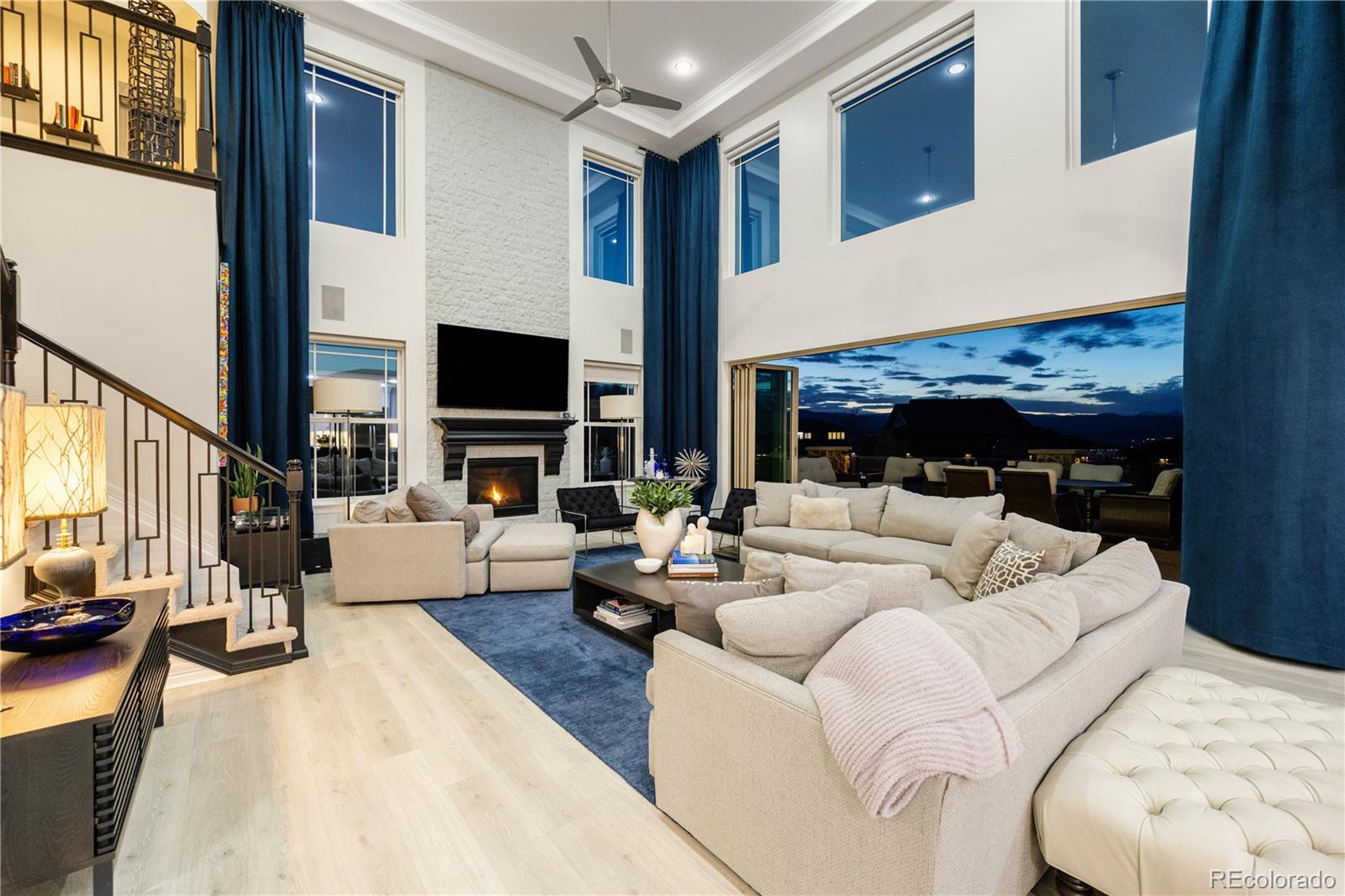 10785 Sundial Rim Road Highlands Ranch, CO 80126 - Photo 42 of 43 a living room with fireplace furniture and a flat screen tv