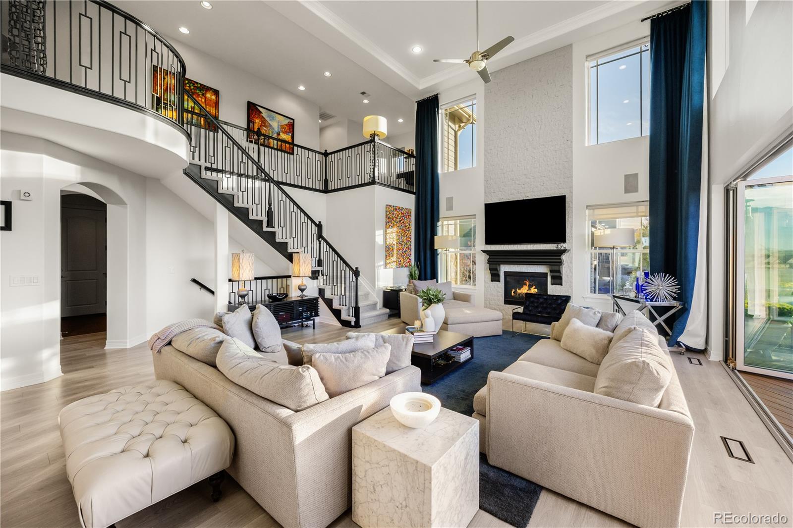 10785 Sundial Rim Road Highlands Ranch, CO 80126 - Photo 6 of 43 a living room with furniture and a flat screen tv