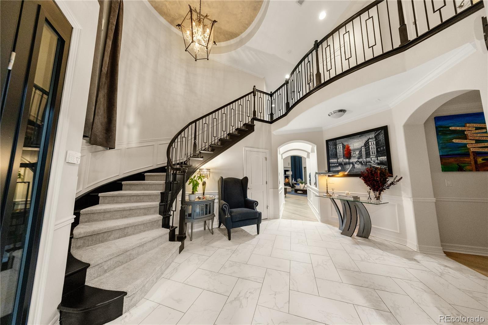 10785 Sundial Rim Road Highlands Ranch, CO 80126 - Photo 7 of 43 a view of entryway and hall with wooden floor