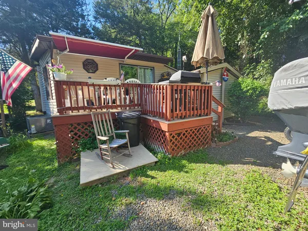 a view of a deck with a yard