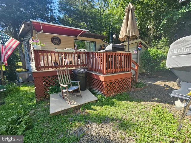 a view of a deck with a yard