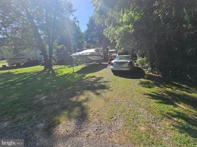 a view of a yard with swimming pool
