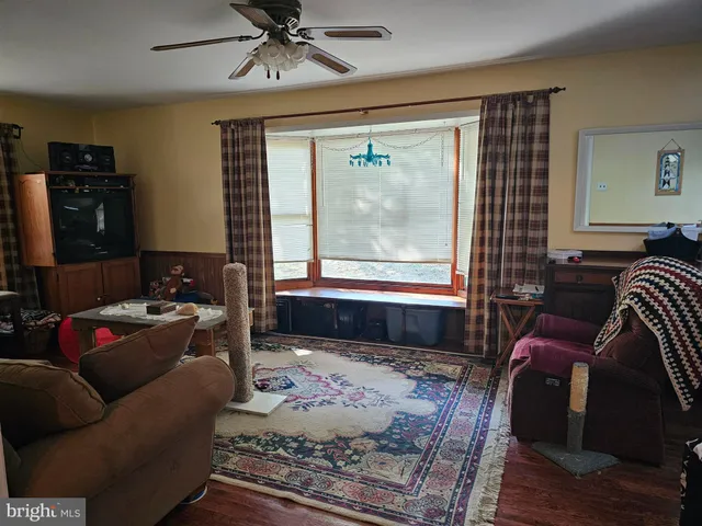 a living room with furniture or couch and a window