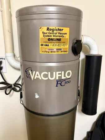 a table with chairs and white walls