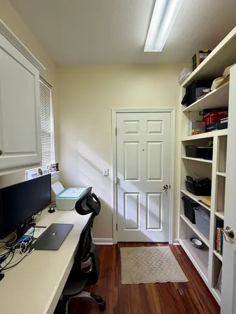 a workspace with furniture and bookshelf