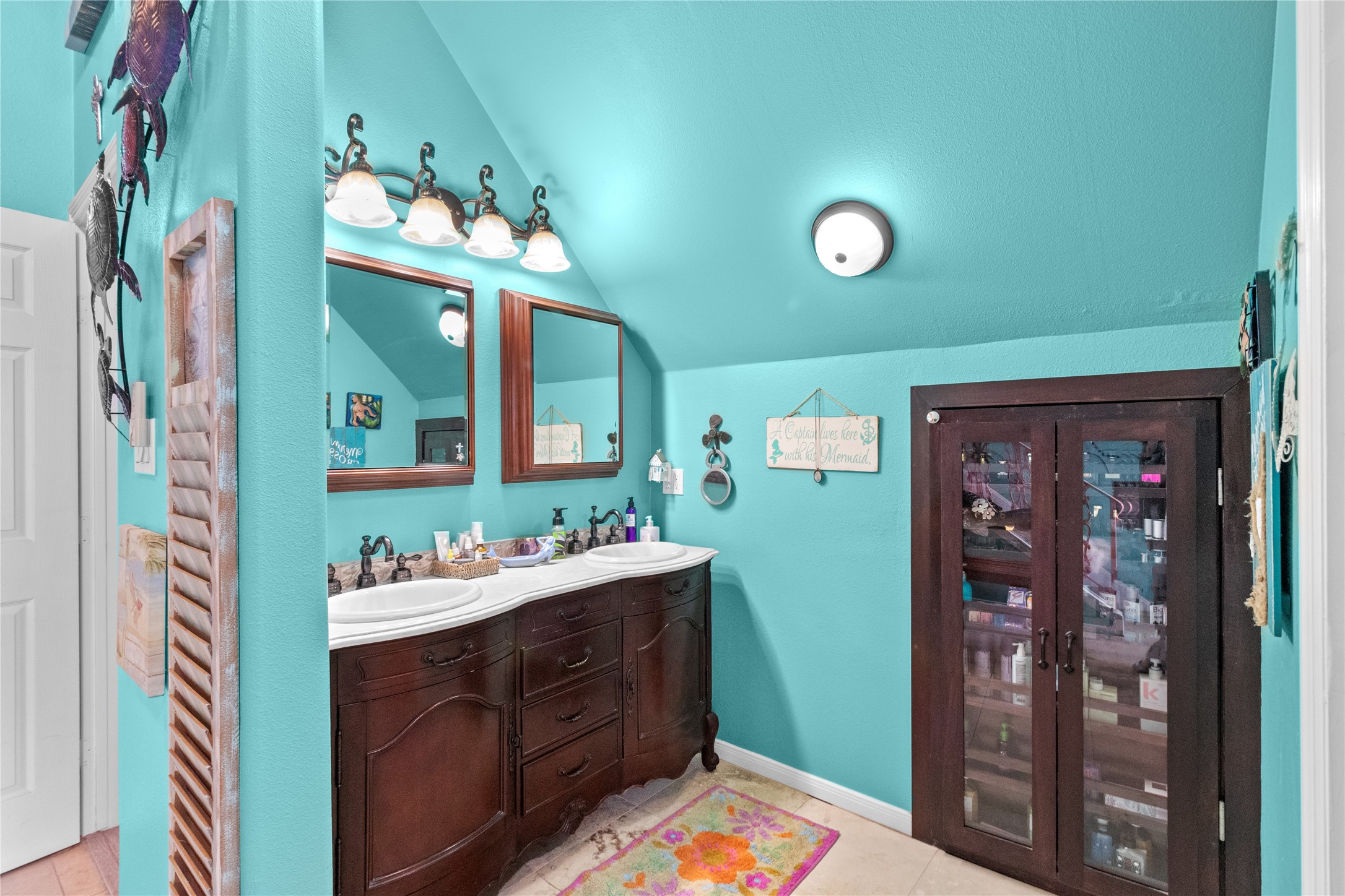 106 Isles End Road Tiki Island, TX 77554 - Photo 11 of 44 a bathroom with a sink mirror and vanity