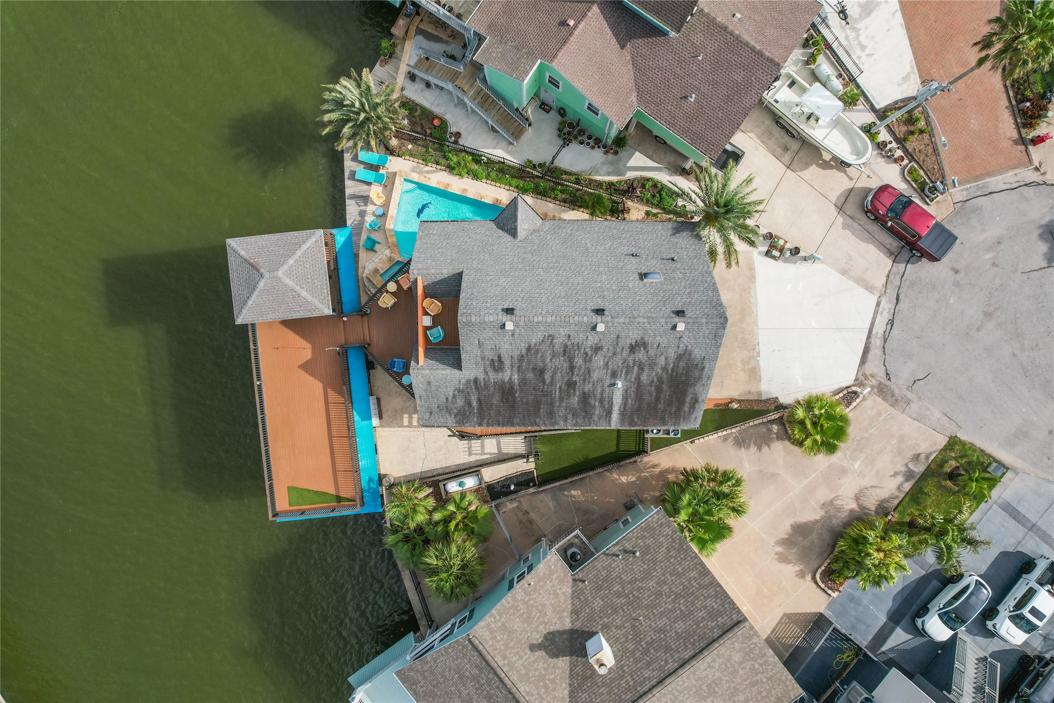 106 Isles End Road Tiki Island, TX 77554 - Photo 21 of 44 an aerial view of a house with a yard and potted plants