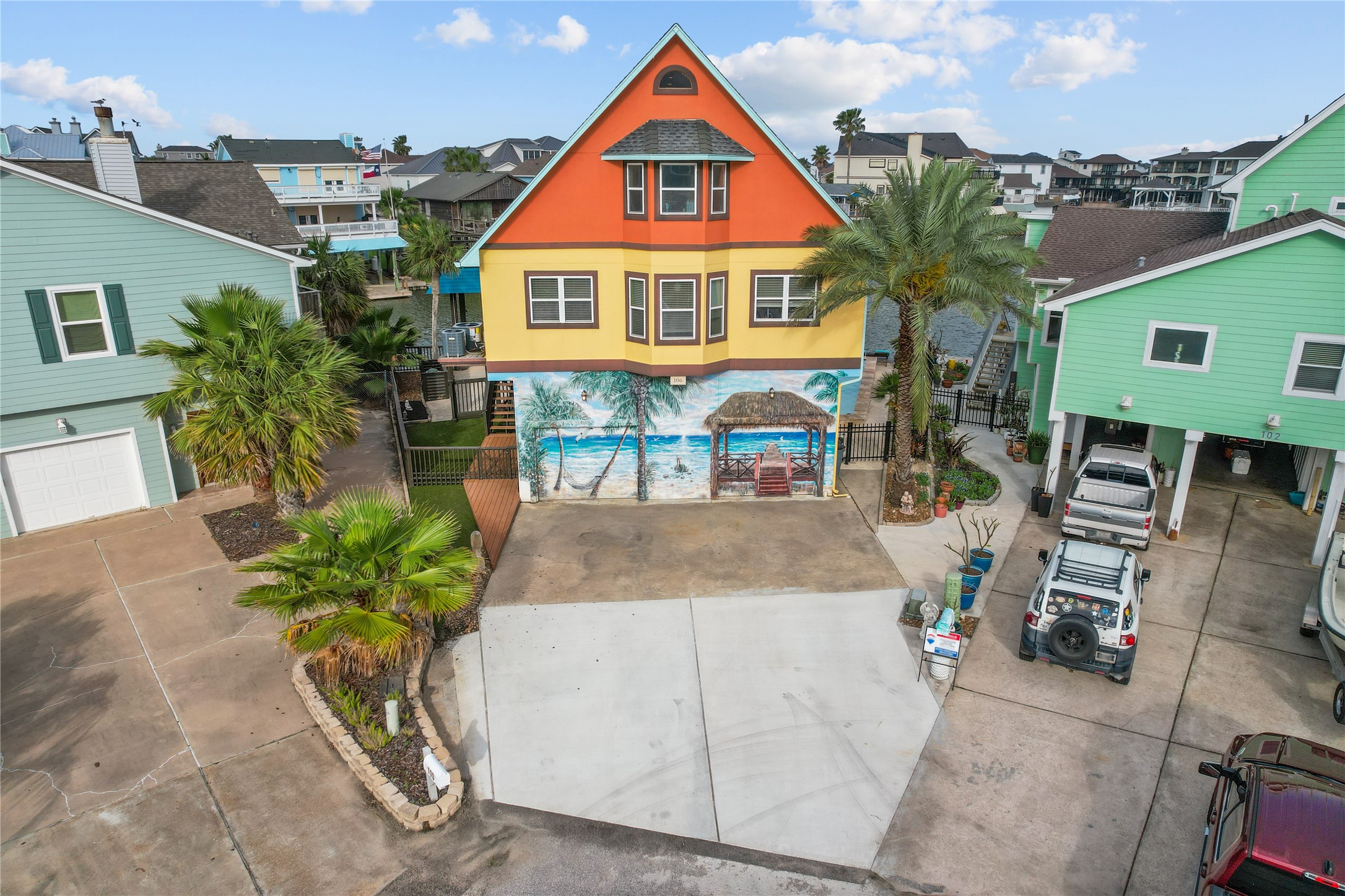106 Isles End Road Tiki Island, TX 77554 - Photo 24 of 44 an aerial view of a house with swimming pool