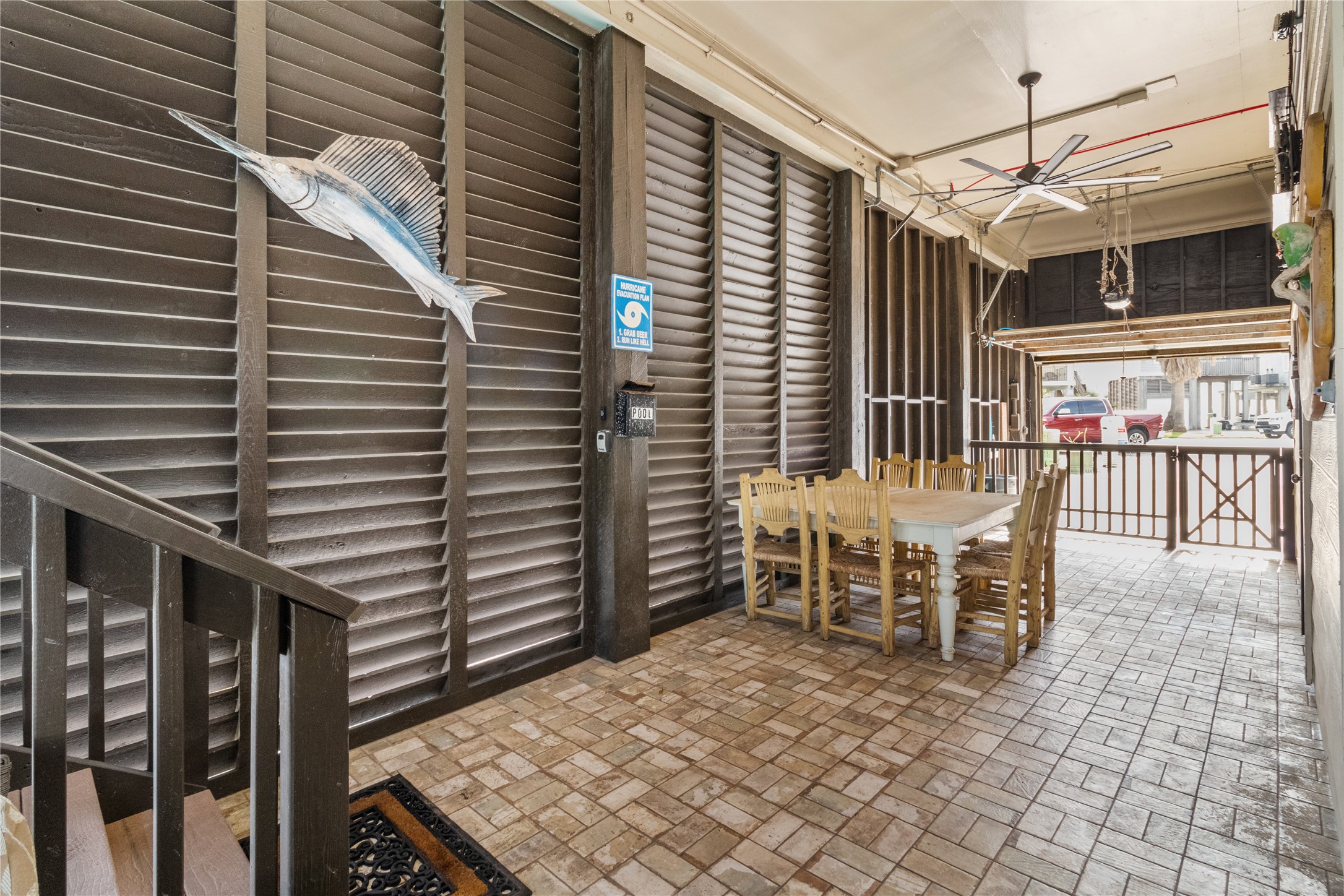 106 Isles End Road Tiki Island, TX 77554 - Photo 26 of 44 a view of a patio with a table and chairs