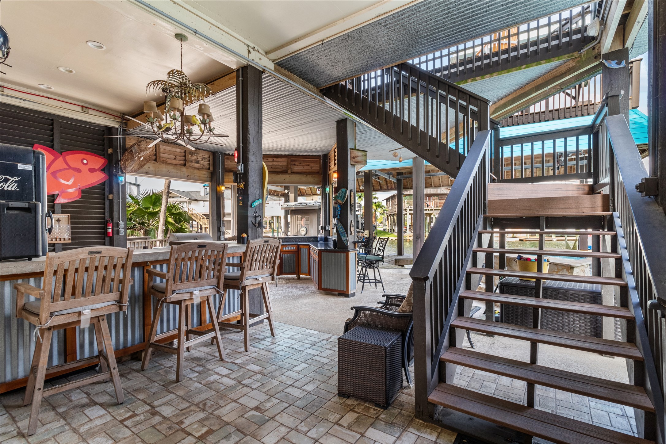 106 Isles End Road Tiki Island, TX 77554 - Photo 30 of 44 a view of an chairs and tables in the patio