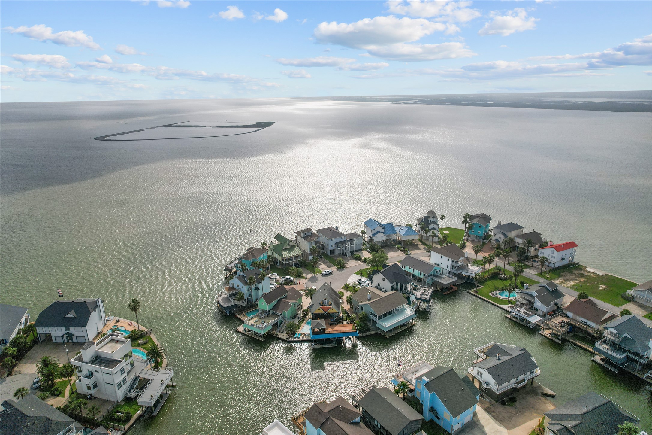 106 Isles End Road Tiki Island, TX 77554 - Photo 32 of 44 a view of a lake with a table