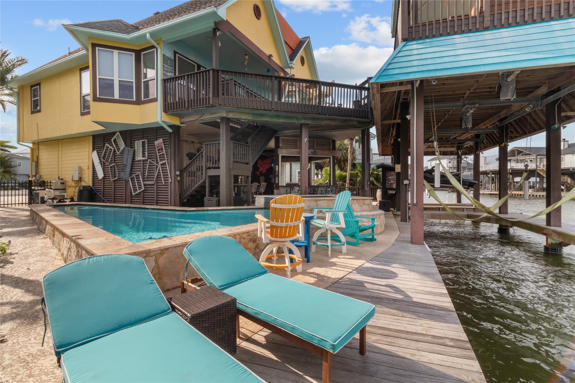 106 Isles End Road Tiki Island, TX 77554 - Photo 36 of 44 a view of a chairs and table in the patio
