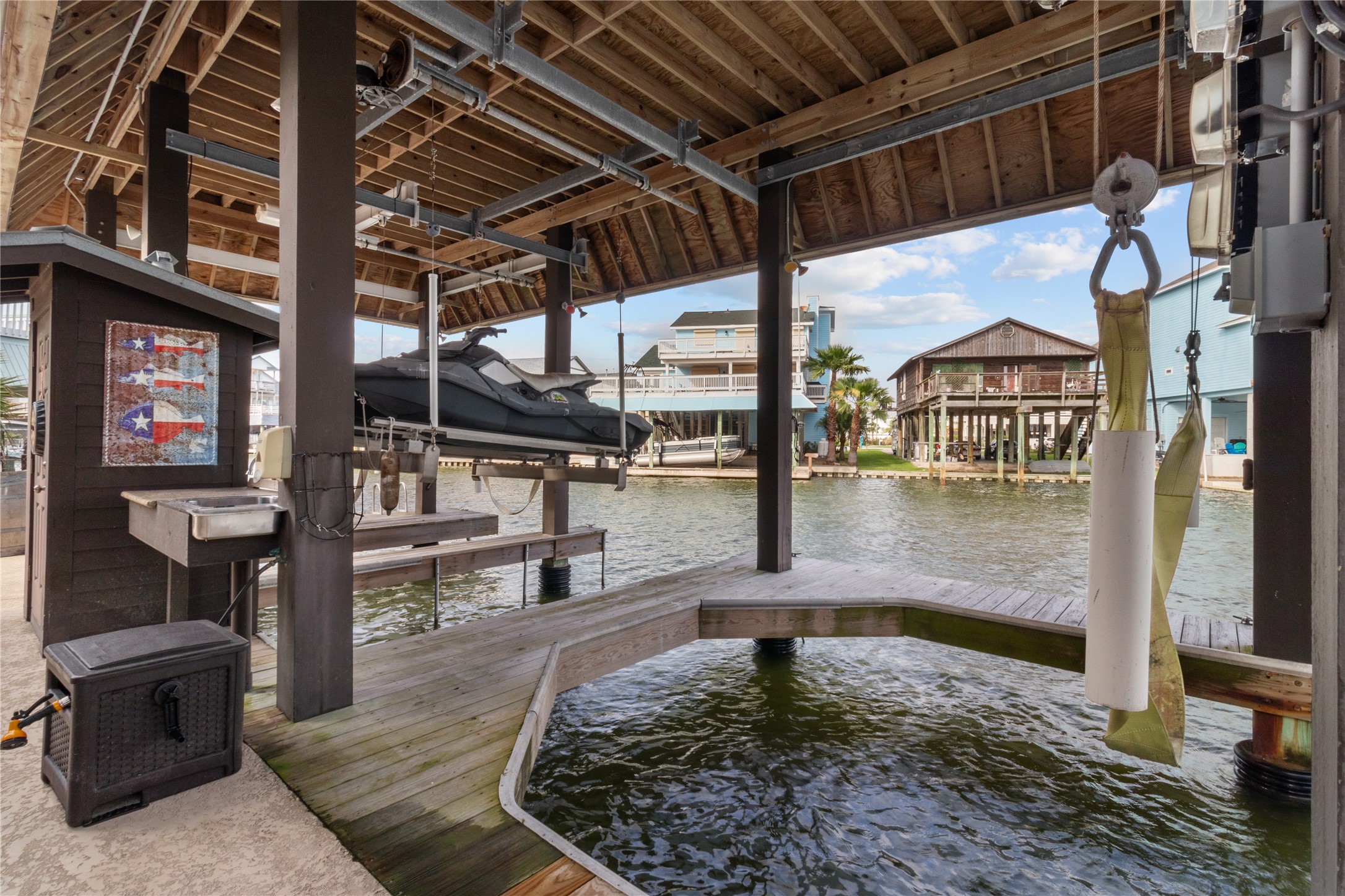 106 Isles End Road Tiki Island, TX 77554 - Photo 37 of 44 a view of a swimming pool with a patio