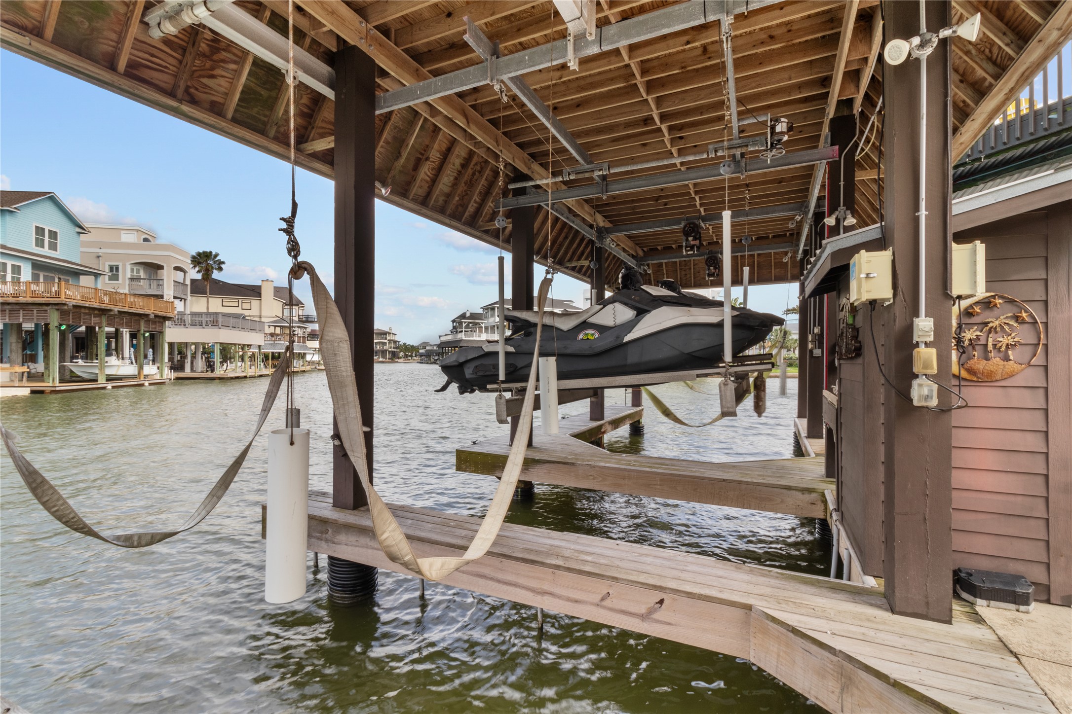 106 Isles End Road Tiki Island, TX 77554 - Photo 38 of 44 a view of a ocean with wooden deck