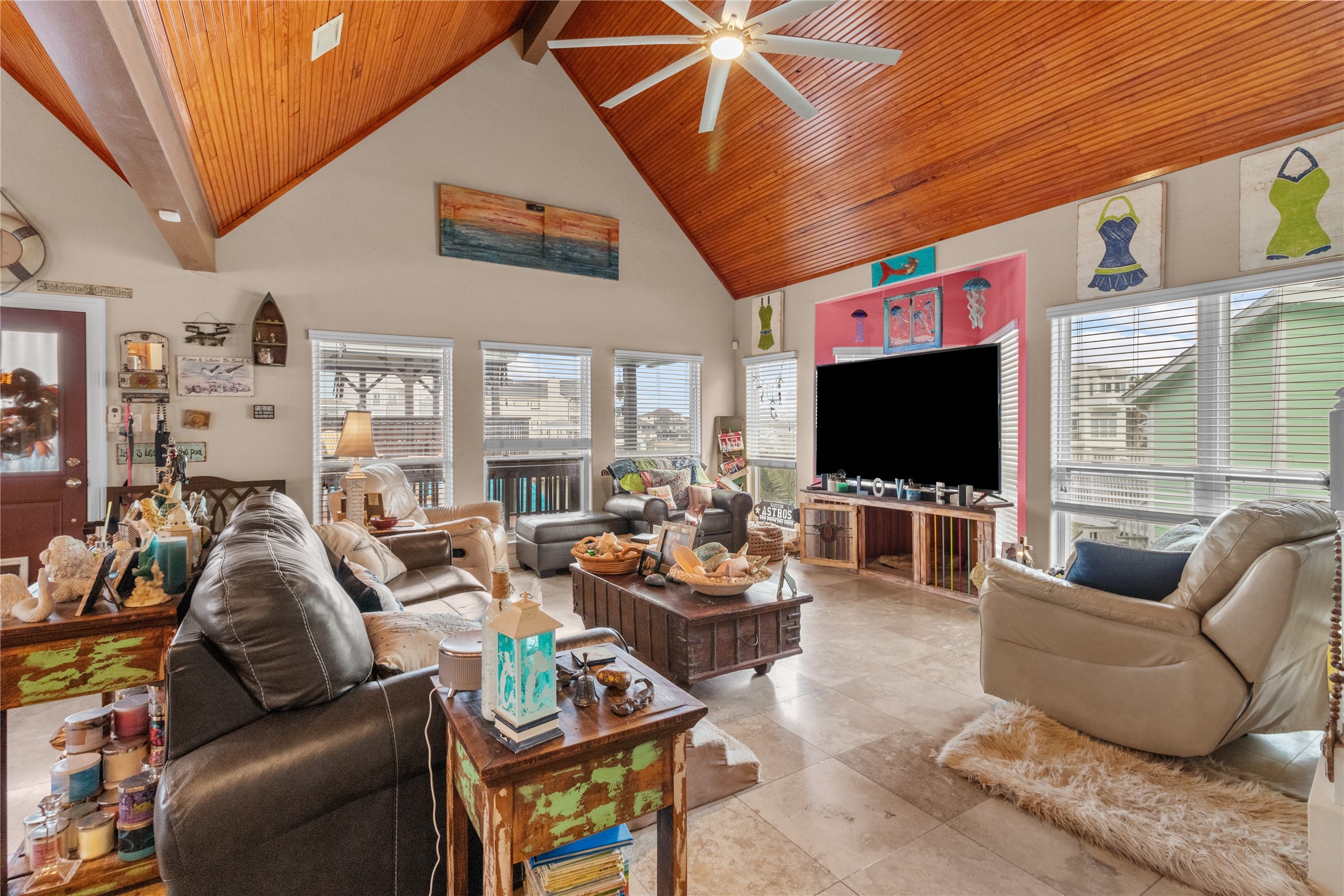 106 Isles End Road Tiki Island, TX 77554 - Photo 4 of 44 a living room with furniture and a flat screen tv