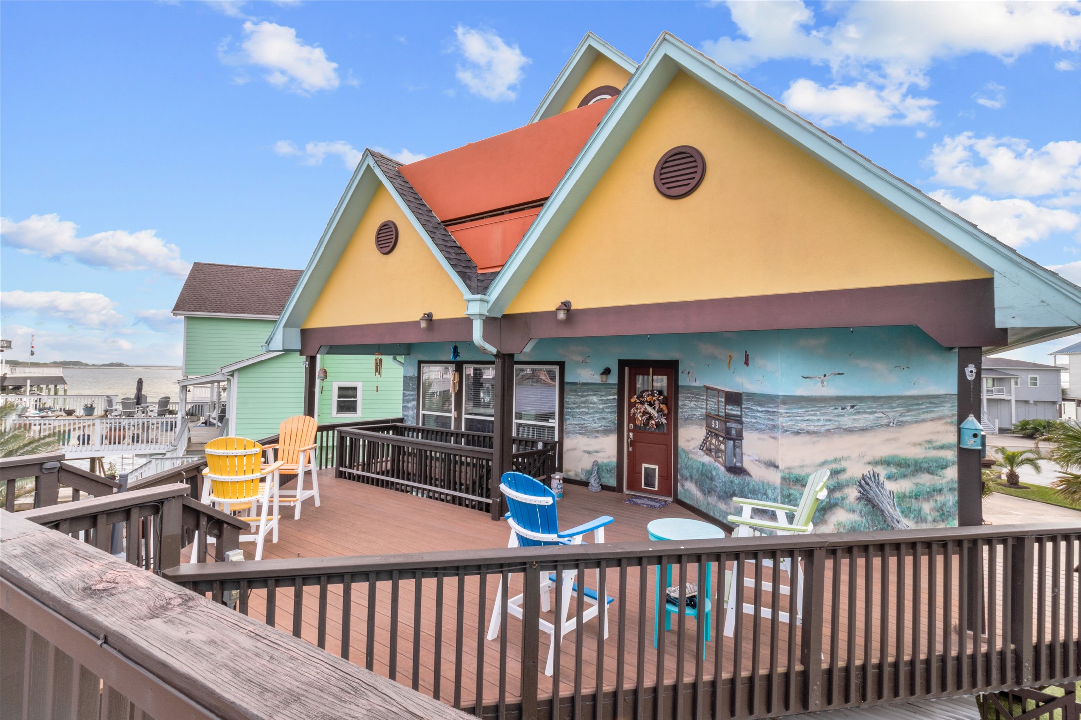 106 Isles End Road Tiki Island, TX 77554 - Photo 41 of 44 a view of a brick house with large windows