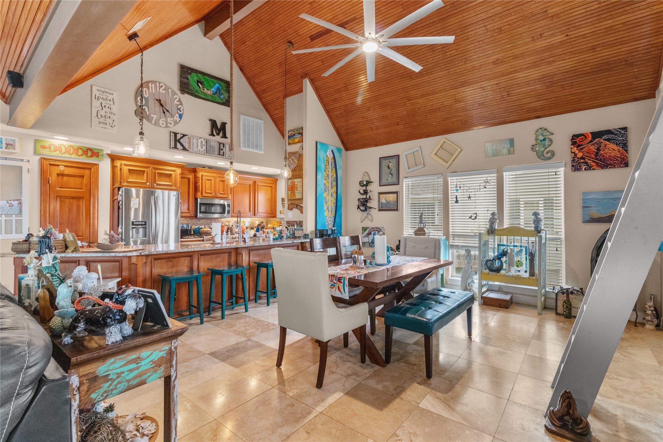 106 Isles End Road Tiki Island, TX 77554 - Photo 5 of 44 a dining room with furniture and a floor to ceiling window