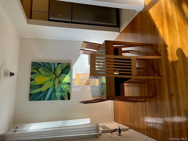 241-20 Northern Boulevard, Unit 3H Queens, NY 11362 - Photo 11 of 16 a view of a dining room with furniture and wooden floor
