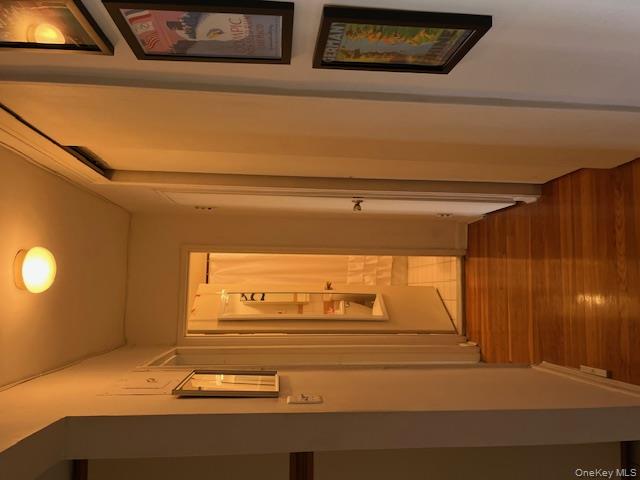 241-20 Northern Boulevard, Unit 3H Queens, NY 11362 - Photo 13 of 16 a view of a hallway with wooden floor and staircase