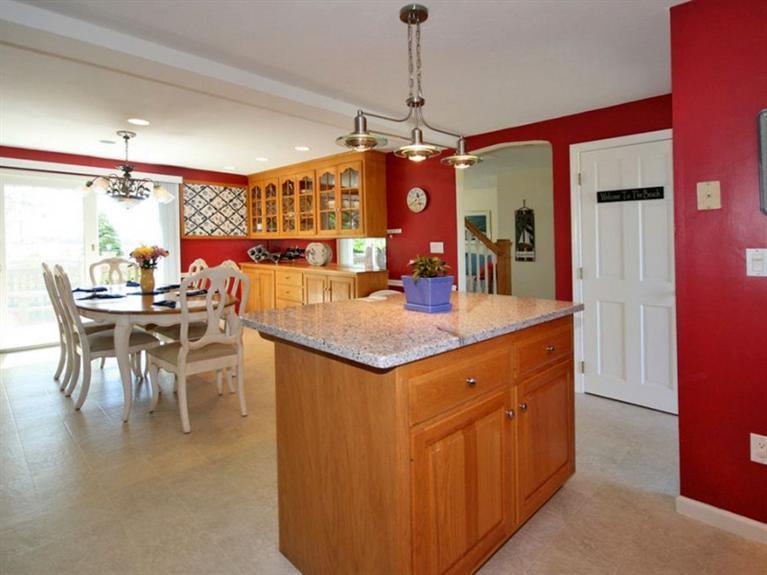 1 Sias Point Road Buzzards Bay, MA 02532 - Photo 15 of 29 a kitchen with stainless steel appliances granite countertop a kitchen island a stove and a cabinets