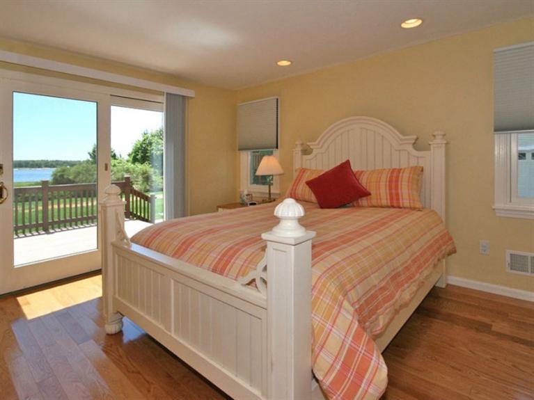 1 Sias Point Road Buzzards Bay, MA 02532 - Photo 7 of 29 a bedroom with a large bed and a large window