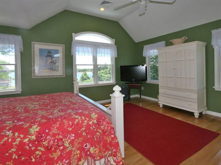 1 Sias Point Road Buzzards Bay, MA 02532 - Photo 9 of 29 a bedroom with a bed and a flat screen tv