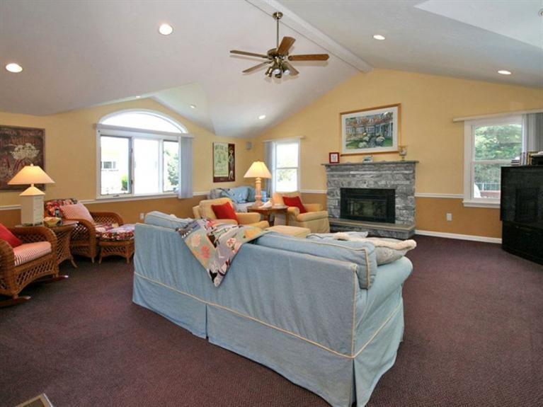 1 Sias Point Road Buzzards Bay, MA 02532 - Photo 10 of 29 a living room with furniture fireplace and a window