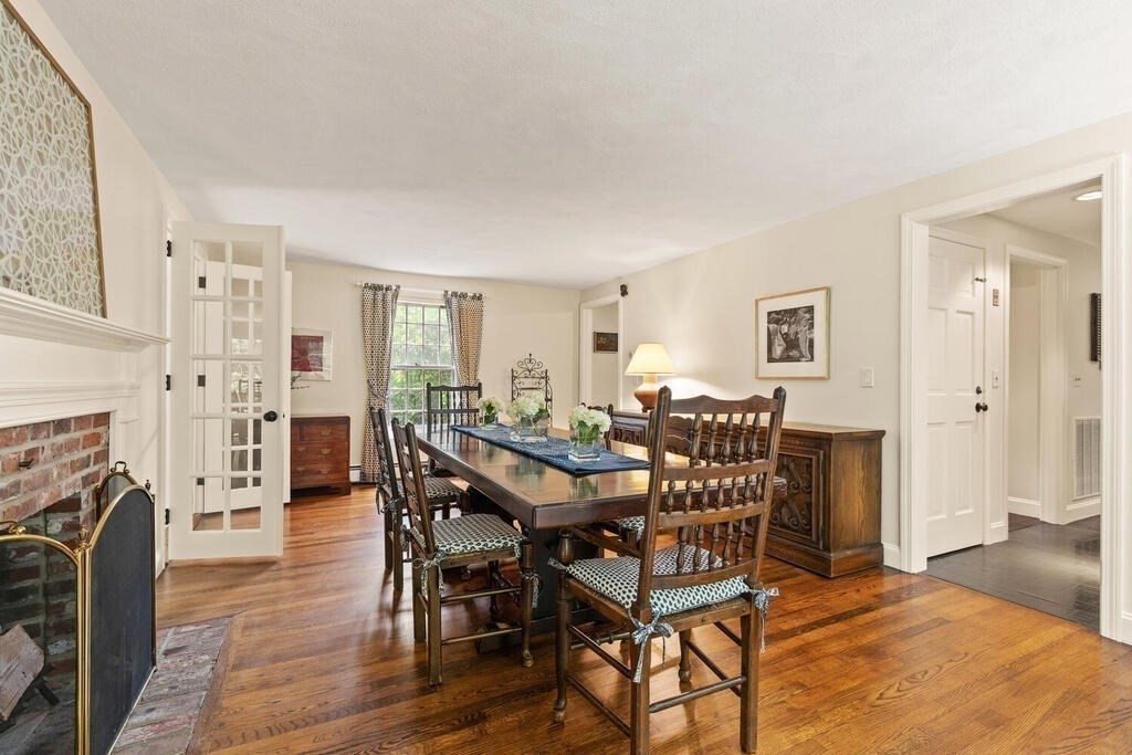 8 Brookhead Avenue Beverly, MA 01915 - Photo 13 of 35 a view of a livingroom with furniture and a fireplace