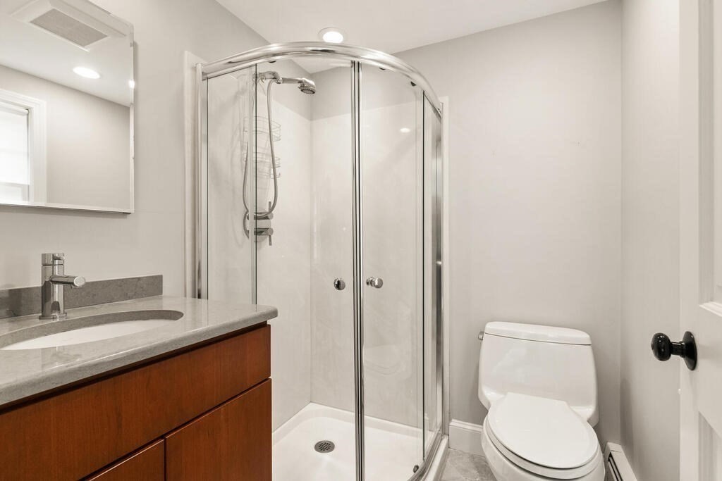 8 Brookhead Avenue Beverly, MA 01915 - Photo 20 of 35 a bathroom with a sink a toilet and shower