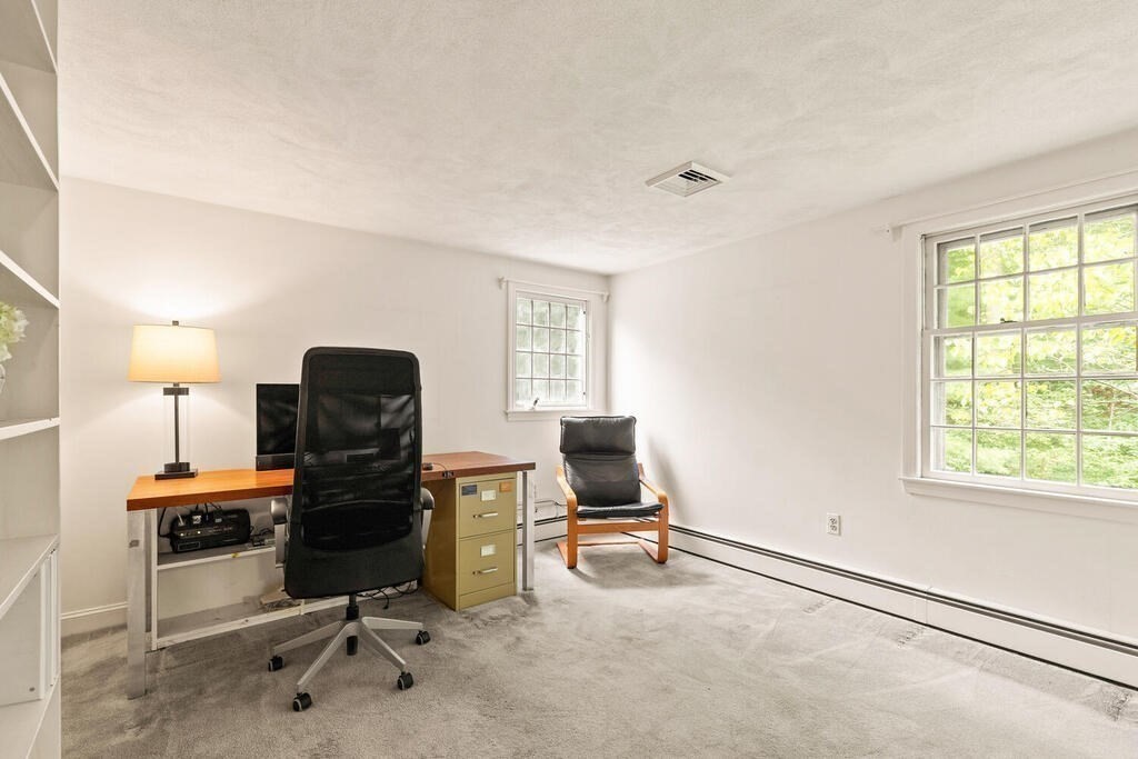 8 Brookhead Avenue Beverly, MA 01915 - Photo 21 of 35 a view of a workspace with furniture and a window