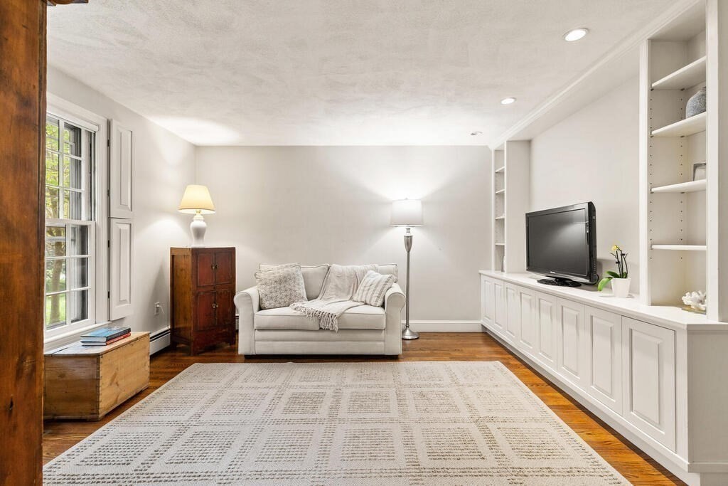 8 Brookhead Avenue Beverly, MA 01915 - Photo 3 of 35 a bedroom with furniture and a flat screen tv