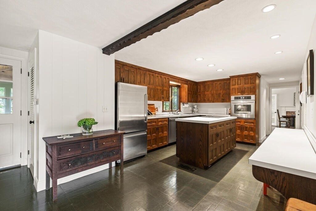 8 Brookhead Avenue Beverly, MA 01915 - Photo 9 of 35 a kitchen with stainless steel appliances kitchen island granite countertop a refrigerator and a stove top oven