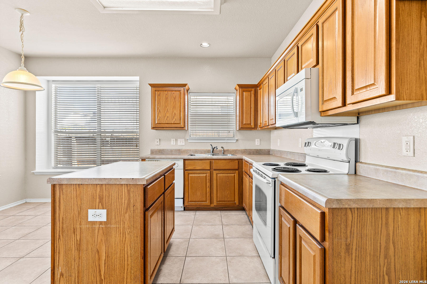 128 Pilot Cibolo, TX 78108 - Photo 16 of 49 a kitchen with stainless steel appliances granite countertop a sink stove and cabinets